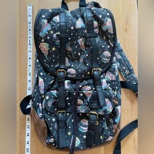 Vintage Mossimo backpack featuring roller skates, burgers, and pizza in pastels